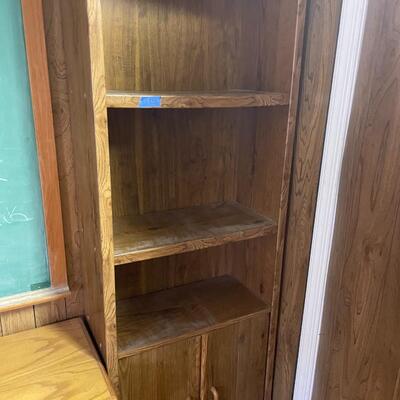 lot 258- tall bookshelf with contents