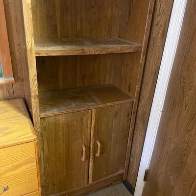 lot 258- tall bookshelf with contents