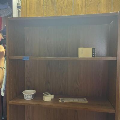 lot 260- tall bookshelf with contents