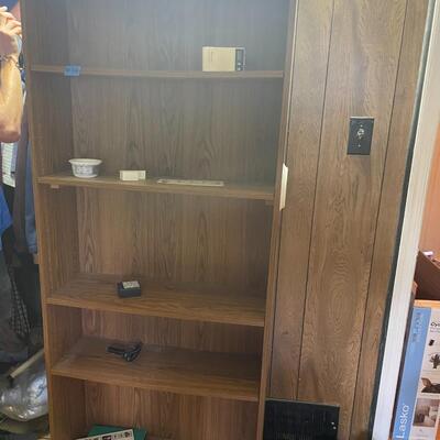 lot 260- tall bookshelf with contents