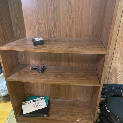 lot 260- tall bookshelf with contents