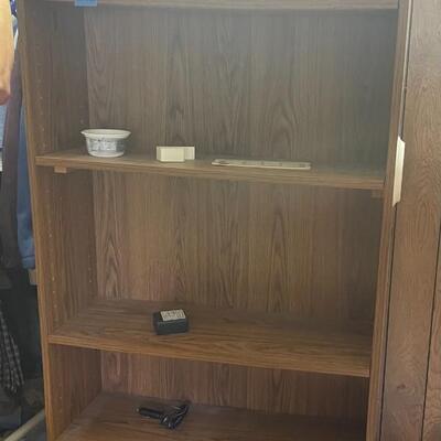 lot 260- tall bookshelf with contents