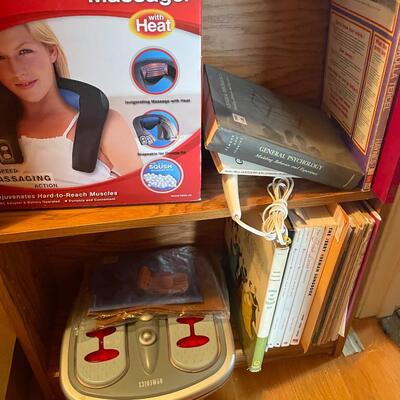 lot 267- Shelf with contents, batteries, massager, books, puzzles, pocket knife, etc.