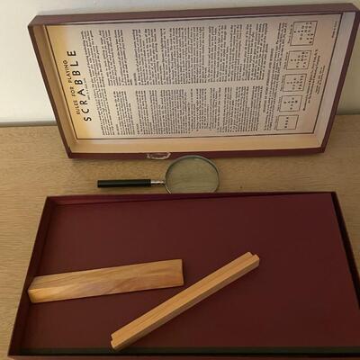 Lot 283- Vintage scrabble game and magnifying glass