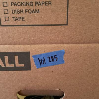 Lot 285- Box of misc. towels, office supplies, belt, ect. 