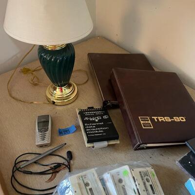 lot 295- TRS-80 buffs, digitizing pen, binders, cassettes, vintage phone, lamp, trashcan, etc.