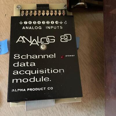 lot 295- TRS-80 buffs, digitizing pen, binders, cassettes, vintage phone, lamp, trashcan, etc.