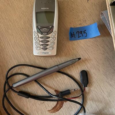 lot 295- TRS-80 buffs, digitizing pen, binders, cassettes, vintage phone, lamp, trashcan, etc.