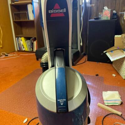 lot 313- Bissel deep cleaner, honeywell fan, misc. decor