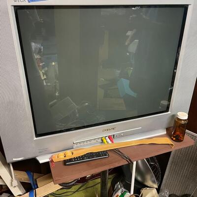 lot 326- Sony tv, table, misc. cords, tools