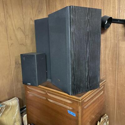 lot 330- large cabinet, speakers, lights, misc. frames and pictures