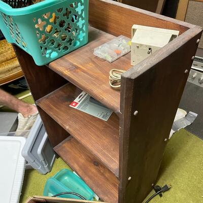 lot 334- misc. plastic containers, bookshelves, misc. items