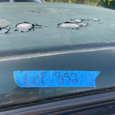 lot 352- 2001 Toyota Corolla 4s green runs great. Title is clear and in hand!