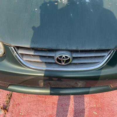 lot 352- 2001 Toyota Corolla 4s green runs great. Title is clear and in hand!