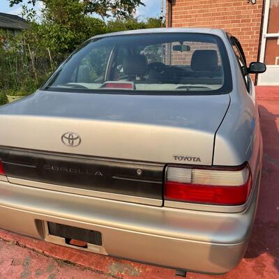 lot 353- 1997 Toyota Corolla 4s silver runs great. Title is clear and in hand!