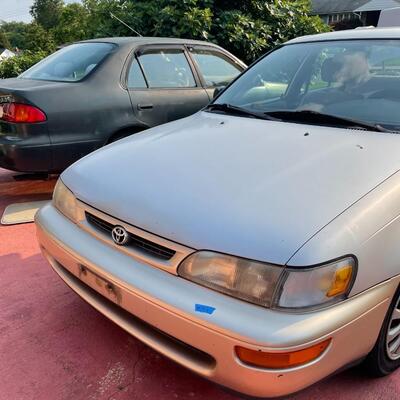 lot 353- 1997 Toyota Corolla 4s silver runs great. Title is clear and in hand!