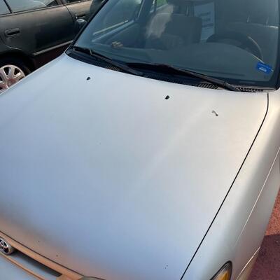 lot 353- 1997 Toyota Corolla 4s silver runs great. Title is clear and in hand!
