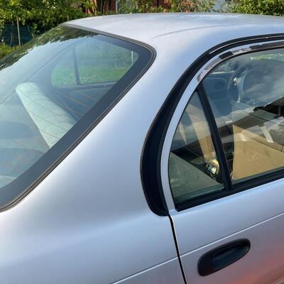 lot 353- 1997 Toyota Corolla 4s silver runs great. Title is clear and in hand!