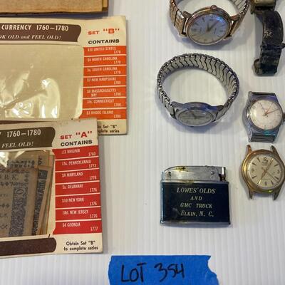 lot 354- stamps, Colonial Revolutionary currency antique reproduction, lighter, watches, lighter