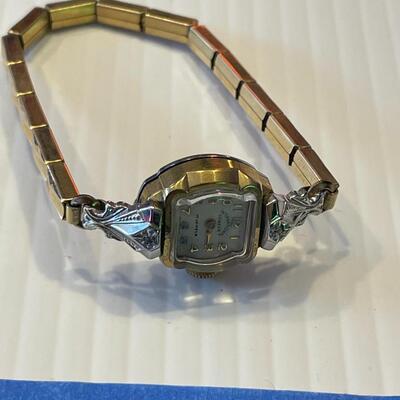 lot 358- 10K rolled gold bezel 17 ruby's and 2 diamond ruby's watch