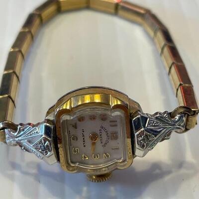 lot 358- 10K rolled gold bezel 17 ruby's and 2 diamond ruby's watch