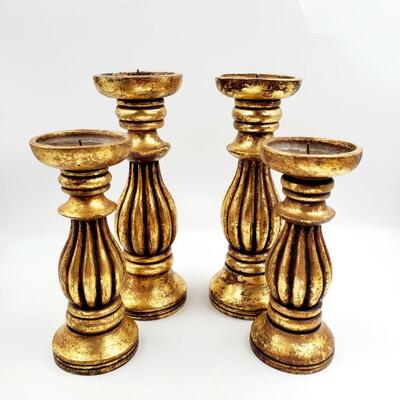 GOLD COLORED PILLAR CANDLE HOLDERS SET OF 4