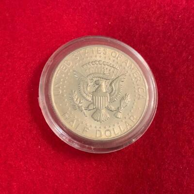 KENNEDY UNCIRCULATED 90% SILVER HALF DOLLAR IN COINTAINER 