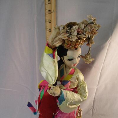 Lot 10 - Korean Doll on Base