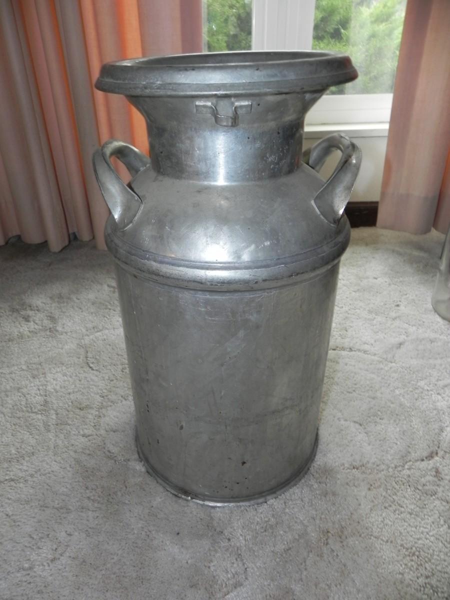 LOT 12 VINTAGE METAL MILK BOTTLE CARRIER & MILK CAN | EstateSales.org