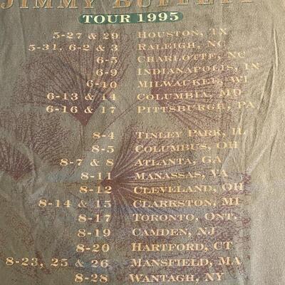Lot 366: Jimmy Buffett Concert Teeâ€™s, Cdâ€™s & Book