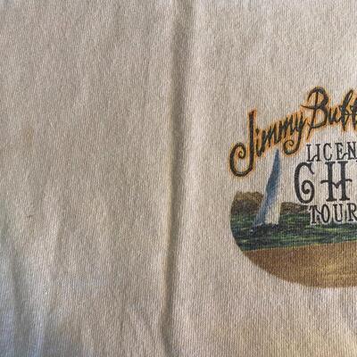 Lot 366: Jimmy Buffett Concert Teeâ€™s, Cdâ€™s & Book