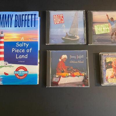 Lot 366: Jimmy Buffett Concert Teeâ€™s, Cdâ€™s & Book