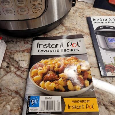 Lot 22: Instant Pot with Multiple Recipe Books and Manual 