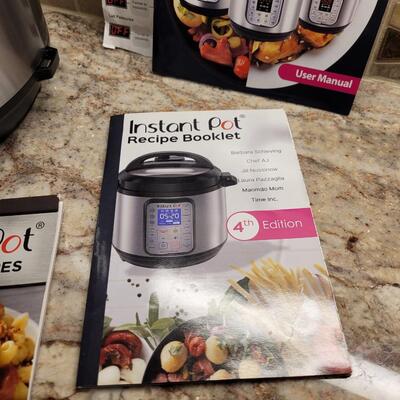 Lot 22: Instant Pot with Multiple Recipe Books and Manual 