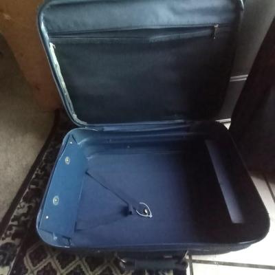 TWO MATCHING LUCAS SUITCASES ON CASTERS WITH PULL HANDLES