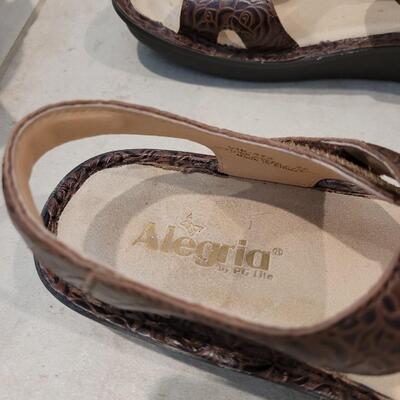 Lot 424: Alegria Brown Tooled Leather with Conchos Sandals Size 38