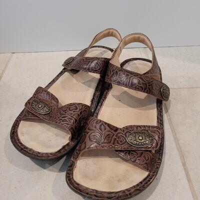 Lot 424: Alegria Brown Tooled Leather with Conchos Sandals Size 38