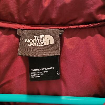 Lot 468: Ladies Northface Puffer Jacket Size Large (color is more purple plum than shows in photos)