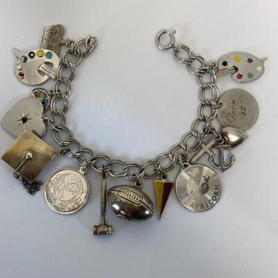 Lot J8 - Sterling silver charm bracelet. 40.37 grams