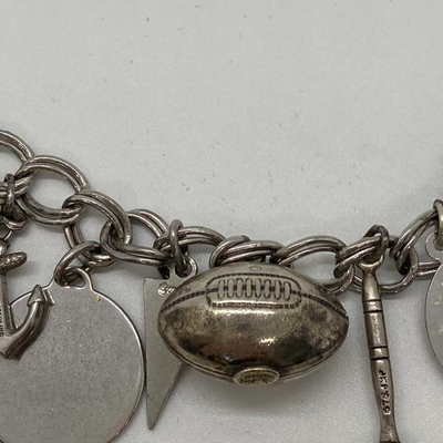 Lot J8 - Sterling silver charm bracelet. 40.37 grams