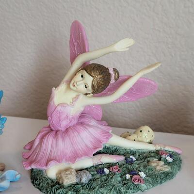 Lot 569: Dancing Fairy and (2) Sitting Fairies