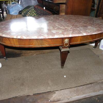 Oval 34 in. Pink French Marble Coffee table.
