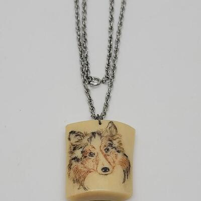 Lot J19 - Handcrafted etched bone Collie pendant on a 24
