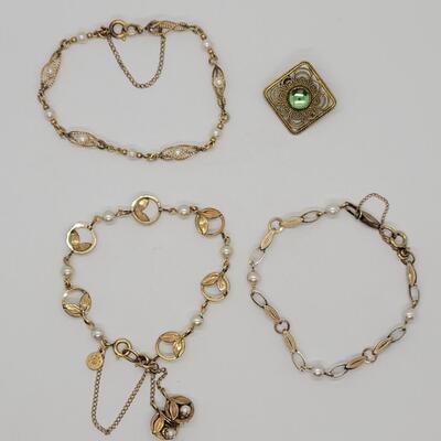 Lot J21 - Three goldfill bracelets all with saftey chains. One signed Vondell, one signed cc other unsigned and Brooch signed Freirich