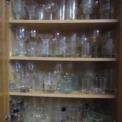 Several Cabinets Full of Misc. Kitchenware- Drinking Glasses, Mugs, Plates, Bowls, Etc.