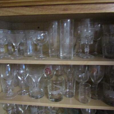 Several Cabinets Full of Misc. Kitchenware- Drinking Glasses, Mugs, Plates, Bowls, Etc.