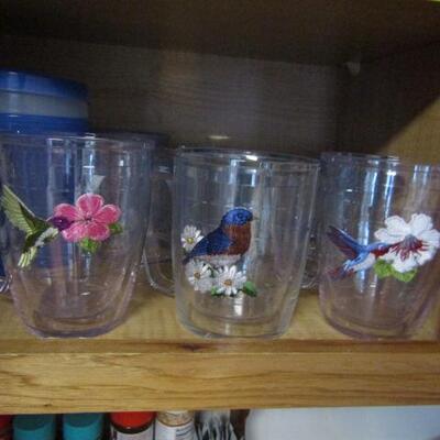 Cabinet Full of Mostly Sports Related Drinkware and Accessories