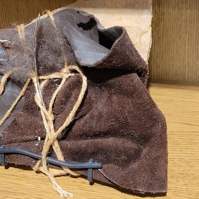 Lot 6: Original Artwork (Stone, leather, Feather bound in Jute Twine with Metal Stand)