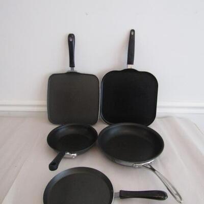 Assortment of Pans from Various Makers- Including Farberware and Calphalon