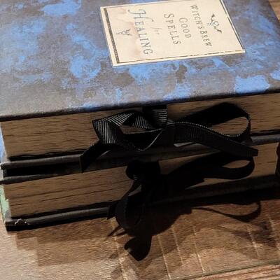 Lot 83: Wheel of the Year Book and Witch's Brew Good Spells Books 